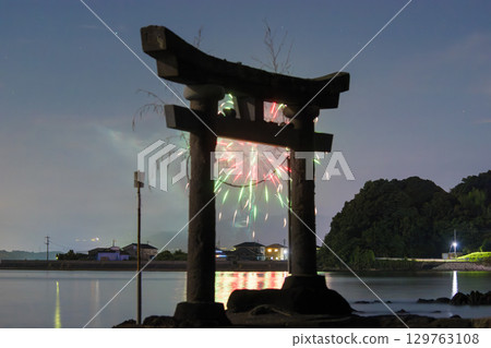 Torii gate and fireworks by the sea 129763108