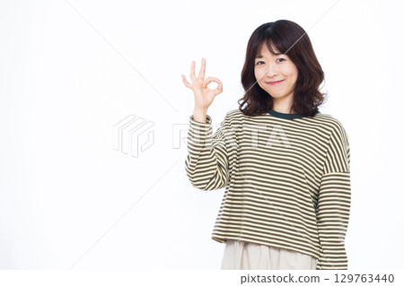 Woman signing OK Woman signing OK 129763440