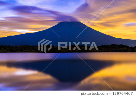 Mount Fuji at dawn as seen from Lake Tanuki 129764467
