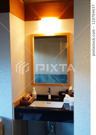 Bathroom sink in hotel 129764637