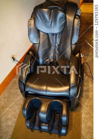 Massage chair in hot spring 129765165