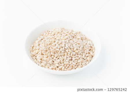 Germ glutinous barley in a plate on a white background 129765242