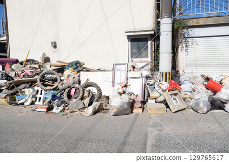 Scene of a residential area where disaster waste is being dumped in front of people's homes. Streetscape after the disaster. 129765617
