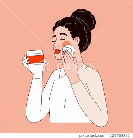 Woman Cleansing Face with Cotton Pad Woman Cleansing Face with Cotton Pad 129765891