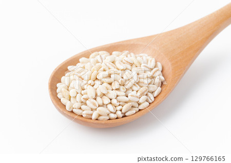 Close-up of germ glutinous barley on a spoon on a white background Close-up of germ glutinous barley on a spoon on a white background 129766165