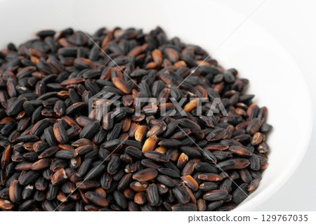 Close-up of black rice in a plate Close-up of black rice in a plate 129767035
