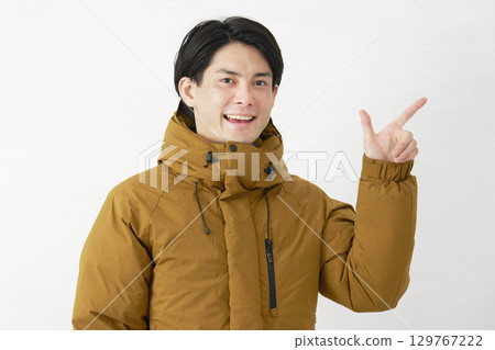 Man wearing down jacket, check sign, white background Man wearing down jacket, check sign, white background 129767222