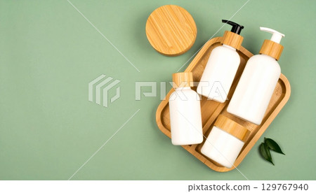 Unhealthy smoking addiction and danger from a red box cigarette pack next to a paint roller and brush 129767940