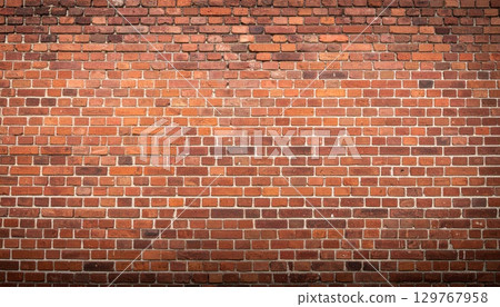 An old red brick wall with a textured pattern of cement and stone blocks An old red brick wall with a textured pattern of cement and stone blocks 129767958