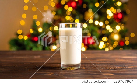 Glass of cold, fresh milk on a wooden table Glass of cold, fresh milk on a wooden table 129767964