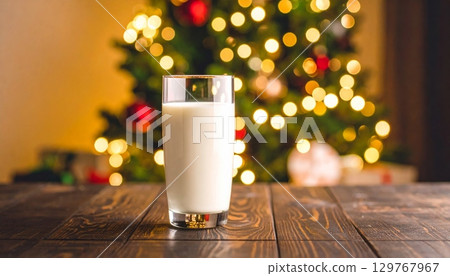 Glass of cold, fresh milk on a wooden table 129767967