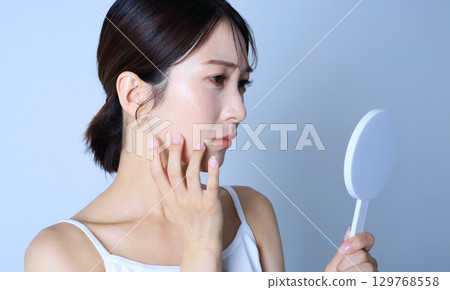 Image of a woman suffering from rough skin Image of a woman suffering from rough skin 129768558
