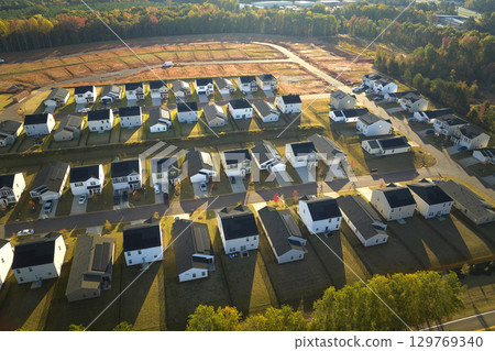 View from above of densely built residential houses under construction in south Carolina residential area. American dream homes as example of real estate development in US suburbs 129769340