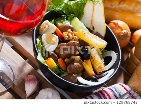 Salad from chicken hearts with peach, pear, quail eggs and grilled cheese Salad from chicken hearts with peach, pear, quail eggs and grilled cheese 129769742
