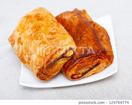 Appetizing stuffed napolitana with ham and cheese 129769774