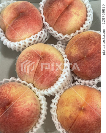 Peaches waiting to be shipped 129769959
