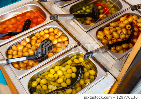Variety of olives being sold at a market Variety of olives being sold at a market 129770136