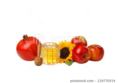 Vibrant red apples, pomegranate, honey, sunflowers, isolated on white, PNG Vibrant red apples, pomegranate, honey, sunflowers, isolated on white, PNG 129770554