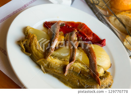 Escalibada with anchovies 129770778