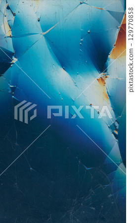 Display failure texture. Broken glass surface. Glossy blue black glare scratched abstract background. Colorful distressed old reflection. 129770858