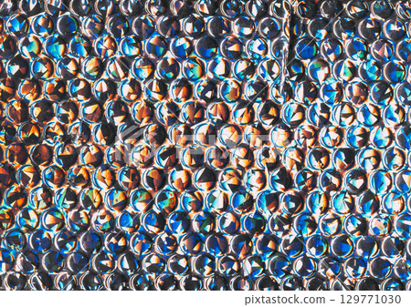 Faceted texture. Colorful background. Bubble wrap art flare round dot fantasy light leak. Futuristic abstract cracked defocused circles pattern. Faceted texture. Colorful background. Bubble wrap art flare round dot fantasy light leak. Futuristic abstract cracked defocused circles pattern. 129771030