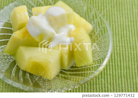 Cut melon with yogurt Cut melon with yogurt 129771432