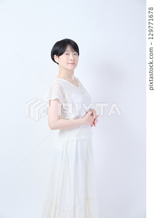 Beauty of a middle-aged woman with short hair 129771678