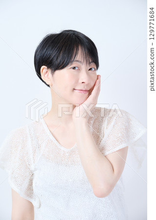 Beauty of a middle-aged woman with short hair Beauty of a middle-aged woman with short hair 129771684