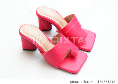 beautiful pink leather heel shoe isolated on white background beautiful pink leather heel shoe isolated on white background 129771838