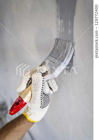 Indonesian southeast asian muslim woman in a sporty outfit practices yoga on a fitness mat in a public park outdoors. Concept of a Healthy active lifestyle 129772400