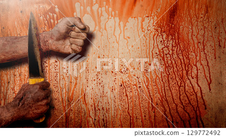 Zombie hand with a bloody wound holding the knife with blood splashes on the wall background. A zombie hand swings the knife to the wrist, creating a tense and scary scene. Concept of Spooky Halloween Zombie hand with a bloody wound holding the knife with blood splashes on the wall background. A zombie hand swings the knife to the wrist, creating a tense and scary scene. Concept of Spooky Halloween 129772492