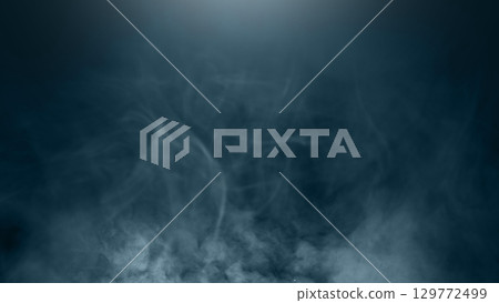 Black background with smoke and steam. The smoke is thick and dark, and the steam is rising from the ground. Dramatic smoke or fog effect. Mockup. Copy Space. Wallpaper or Halloween background 129772499