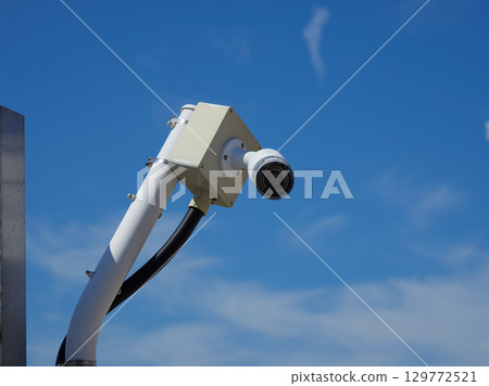 Surveillance cameras installed on the airport fence 129772521