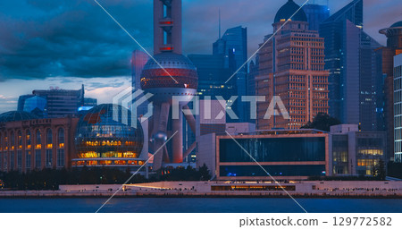 Iconic Shanghai Landmarks Captured During Evening Glow with City Lights Shining Iconic Shanghai Landmarks Captured During Evening Glow with City Lights Shining 129772582