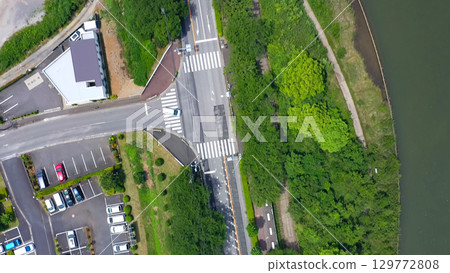 Aerial view of modern city and gardens taken by drone 129772808