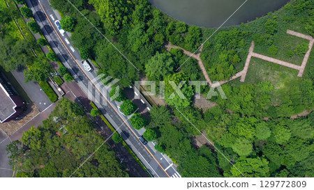 Aerial view of modern city and gardens taken by drone 129772809