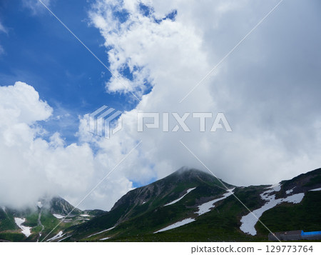 A summer tourist attraction: the magnificent view of the summit of Mt. Murodo on the Tateyama Kurobe Alpine Route A summer tourist attraction: the magnificent view of the summit of Mt. Murodo on the Tateyama Kurobe Alpine Route 129773764