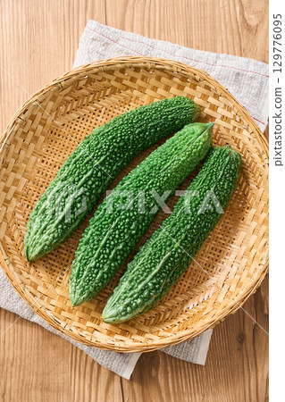 Bitter melon | Okinawan summer vegetables served on a bamboo basket Bitter melon | Okinawan summer vegetables served on a bamboo basket 129776095