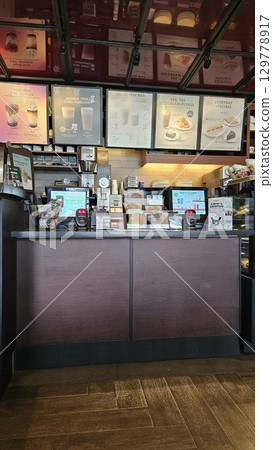 this is food and drink display at cafe  129778917