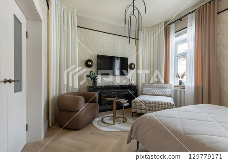 Modern Interior with TV, Fireplace and Cozy Furniture 129779171
