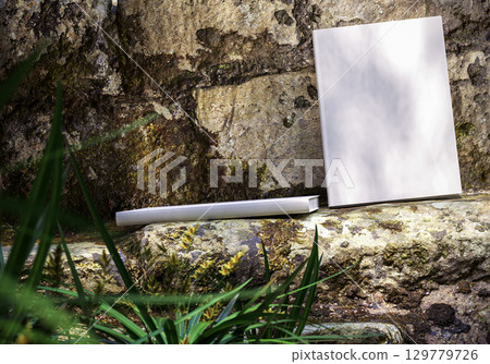 Book mockup on natural stone background outdoors, blank cover for design, branding, education, storytelling, creativity, and inspirational concepts Book mockup on natural stone background outdoors, blank cover for design, branding, education, storytelling, creativity, and inspirational concepts 129779726