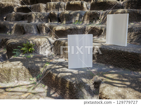 Book mockup on outdoor natural stone staircase, blank cover for design, branding, education, storytelling, creative inspiration, and rustic nature scene Book mockup on outdoor natural stone staircase, blank cover for design, branding, education, storytelling, creative inspiration, and rustic nature scene 129779727