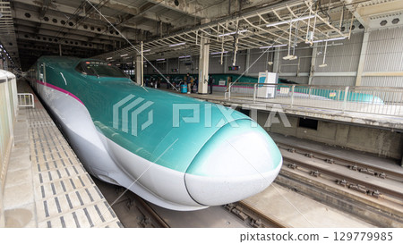 Tohoku Shinkansen arrive in Sendai station as part of east Japan railway. Tohoku Shinkansen arrive in Sendai station as part of east Japan railway. 129779985