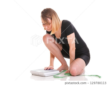Caucasian young woman weight scale isolated white 129780113