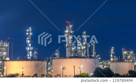 Oil and gas refinery plant at night, Global business energy logistic transportation, Oil and gas refinery petrochemical industrial, Petrochemical refinery industrial energy supply chain. 129780404