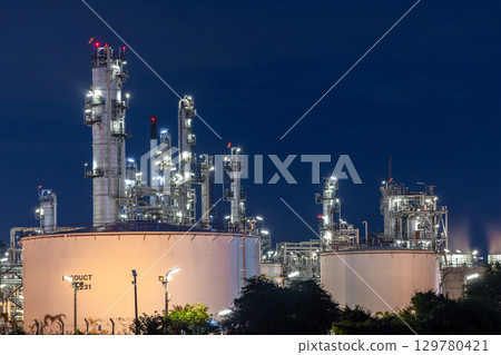 Oil and gas refinery plant at night, Global business energy logistic transportation, Oil and gas refinery petrochemical industrial, Petrochemical refinery industrial energy supply chain. Oil and gas refinery plant at night, Global business energy logistic transportation, Oil and gas refinery petrochemical industrial, Petrochemical refinery industrial energy supply chain. 129780421