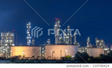 Oil and gas refinery plant at night, Global business energy logistic transportation, Oil and gas refinery petrochemical industrial, Petrochemical refinery industrial energy supply chain. 129780424