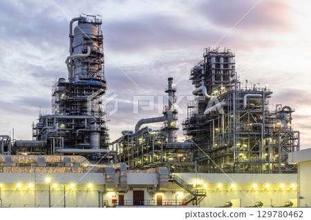 Oil and Gas refinery petrochemical plant industrial on sunset background, Oil and Gas refinery petrochemical plant pipeline steel, Oil and Gas refinery factory maintenance, Global energy refinery. 129780462