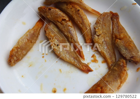 dried fish in basket and plate dried fish in basket and plate 129780522