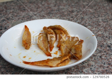 dried fish in basket and plate dried fish in basket and plate 129780526